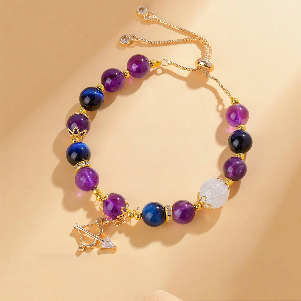 Sagittarius Zodiac Bracelet featuring Blue Tiger Eye, 8mm Amethyst, and 10mm Flower Quartz beads. Gold adjustable healing jewelry for protection with a Bow and Arrow charm - Kosmos Zen