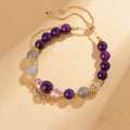 Scorpio Zodiac Bracelet featuring Amethyst, Lavender Amethyst, and Labradorite beads. Gold adjustable healing jewelry for transformation and intuition with a crystal vine charm - Kosmos Zen